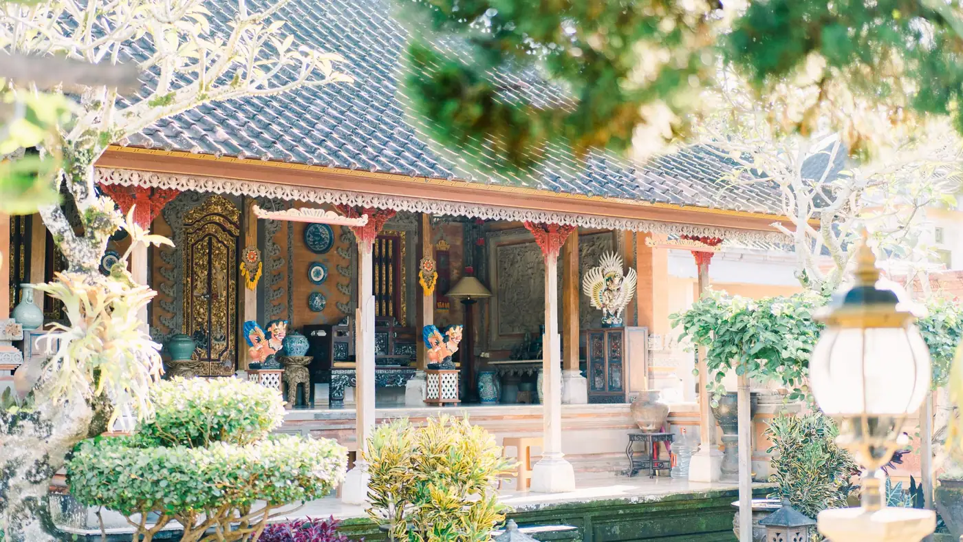 Illustrative photo: a traditional Balinese house with a garden